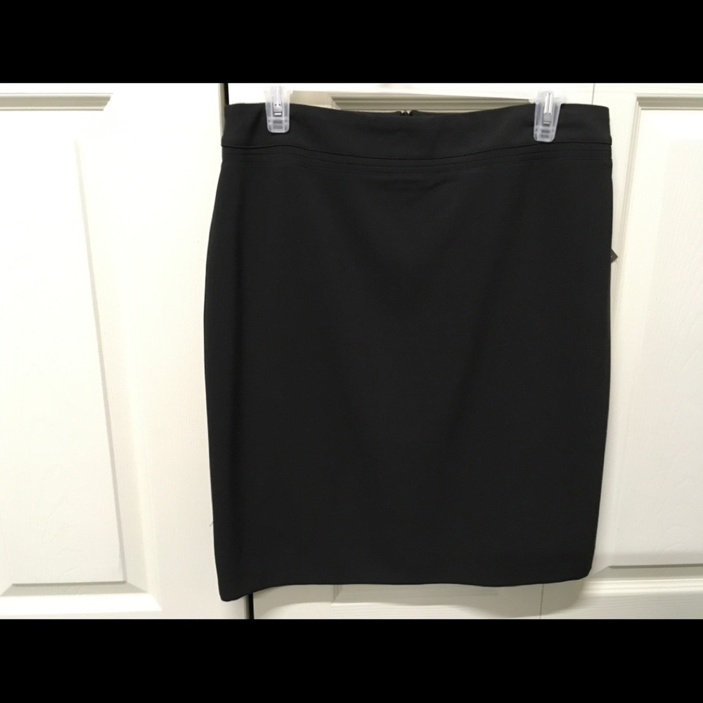 Black, lined, back zip skirt. Never worn.